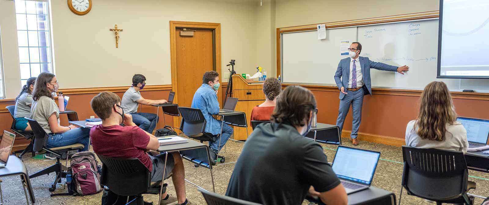 A classroom of masked students.