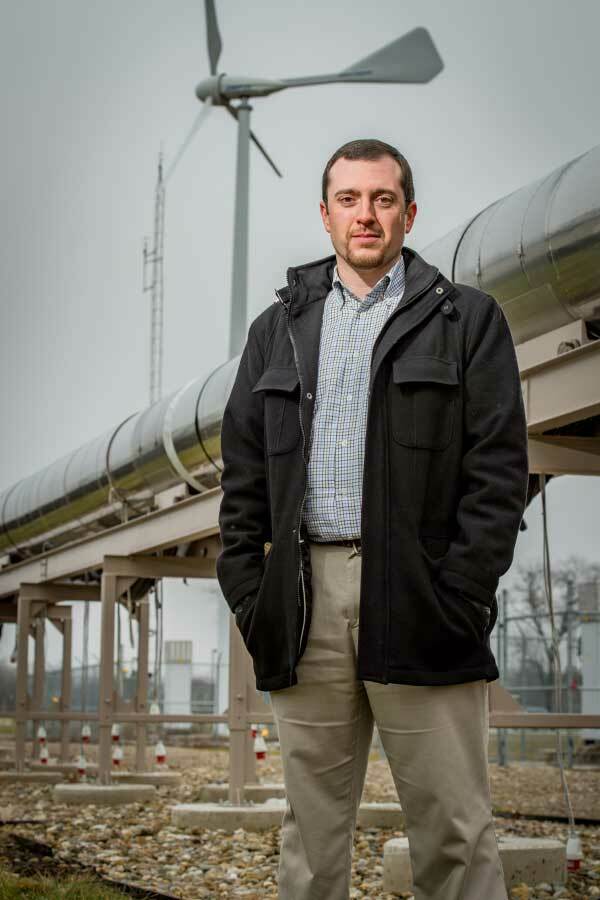 Thomas Juliano standing in front of the wind tunnel.