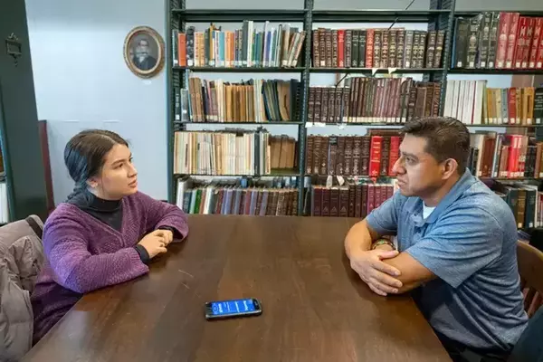 Brain scans in the background of a title slide named Fighting to combat america's health crisis.