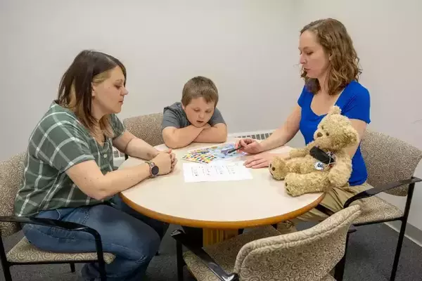 Brain scans in the background of a title slide named Fighting to combat america's health crisis.