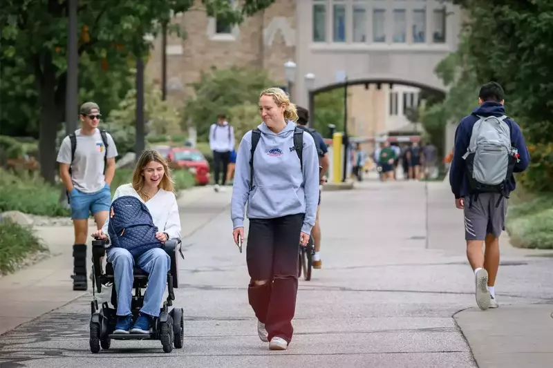 Annie Hamilton and Olivia Guilford chat on their way to their residence hall.