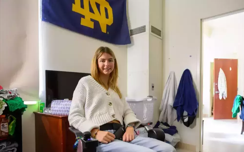Annie Hamilton at her desk in her residence hall.
