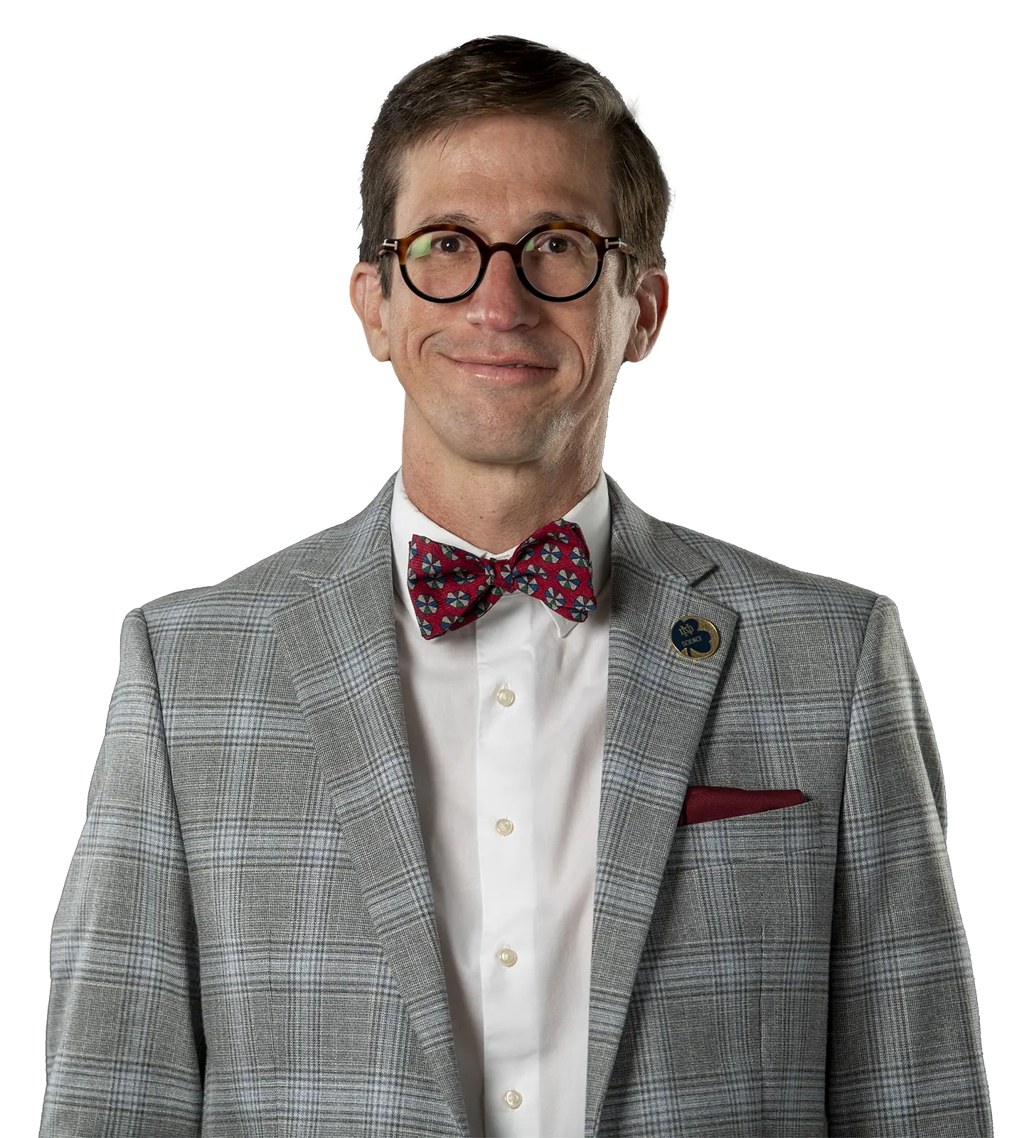 Portrait of Santiago Schnell wearing a gray suit with red bow-tie