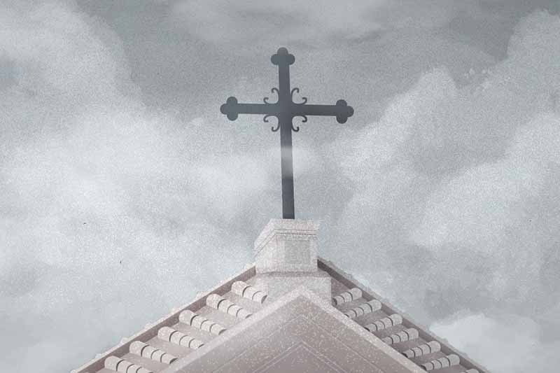 An illustrated cross on the top of a building against a cloudy grey sky. 