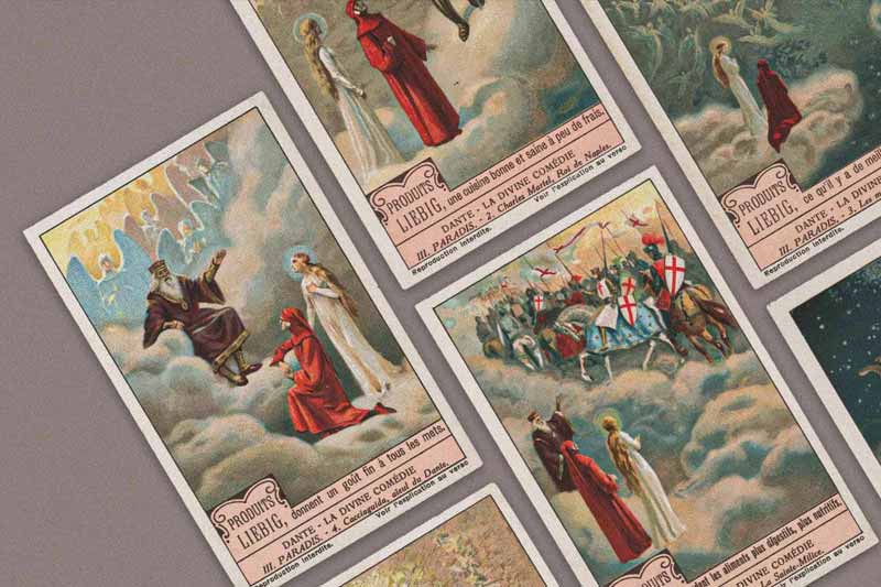 Several old Liebig trade cards featuring colorful religious and mythical illustrations are arranged on a gray background. 