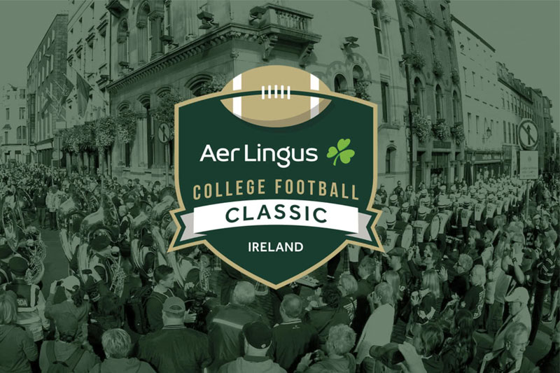 A graphic featuring the Aer Lingus College Football Classic logo. The logo, which includes a football and a shamrock, is superimposed over a black-and-white photo of a parade or a large crowd. 