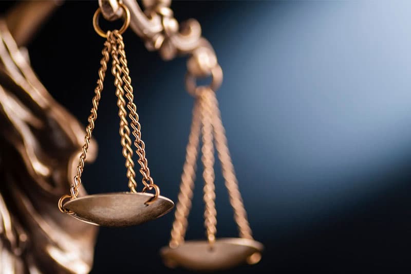 Cropped view of a statue of Justice with the scales of law and order.