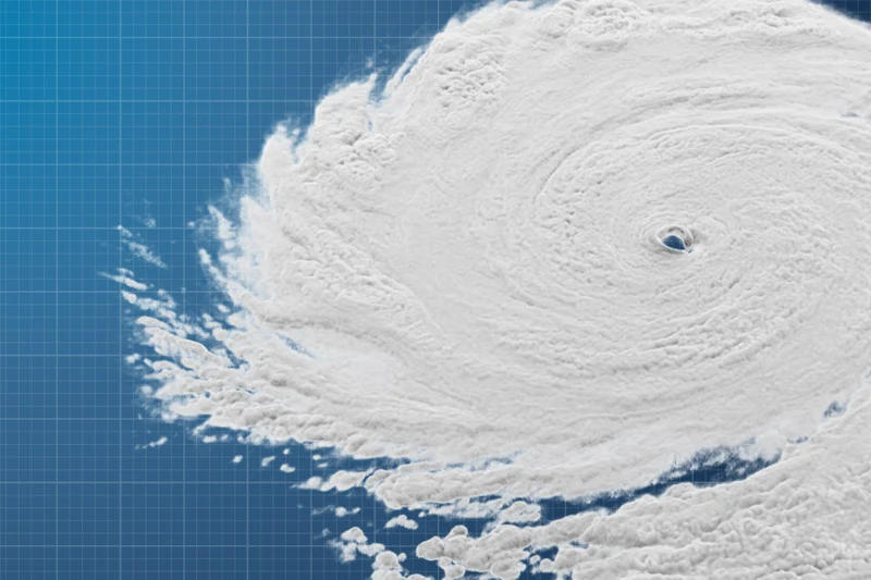 Satellite image of a hurricane with a clearly defined eye over a blue gridded map.
