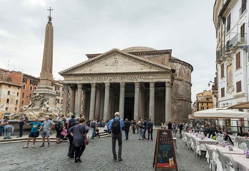 Tourists walk and take photos near The Pantheon.