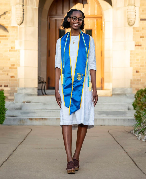 A 3D-printed white plastic cylinder with a clear plastic tube inserted. A small, rectangular piece of white plastic is attached to the cylinder..