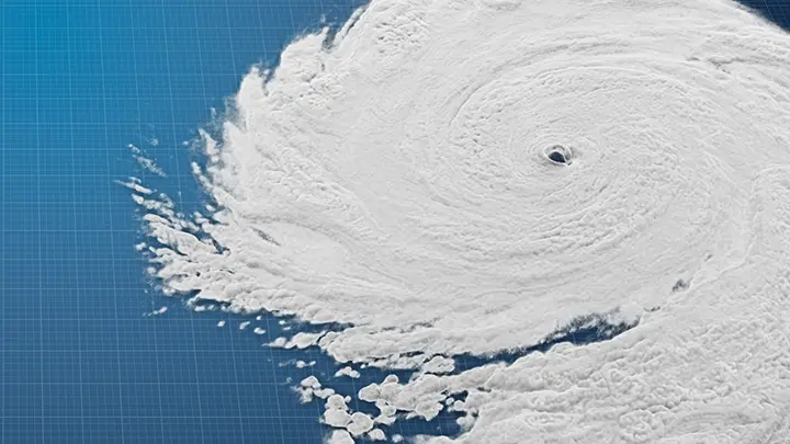 A simulated hurricane on top of a blue grid background.