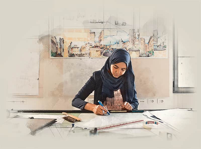A young woman wearing a headscarf sketches at a table, several watercolor paintings are pinned on the wall behind her.