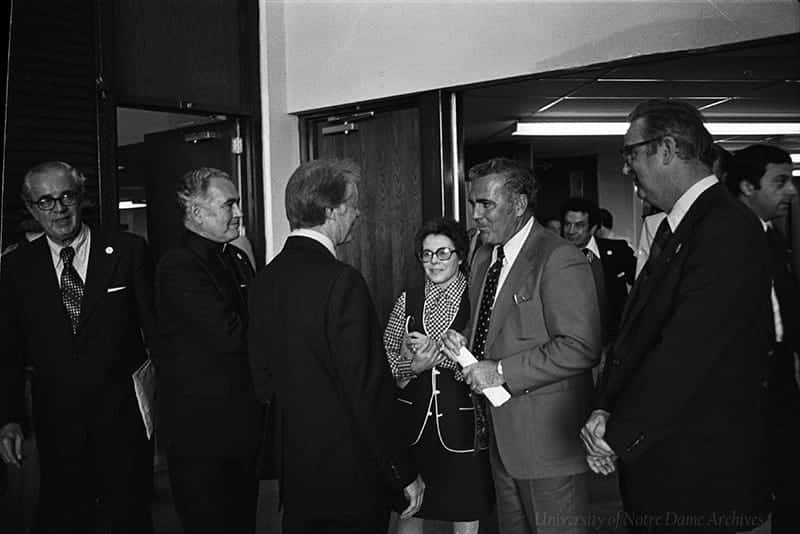 Jimmy Carter talks with Father Hesburgh and football coach Ara Parseghian.