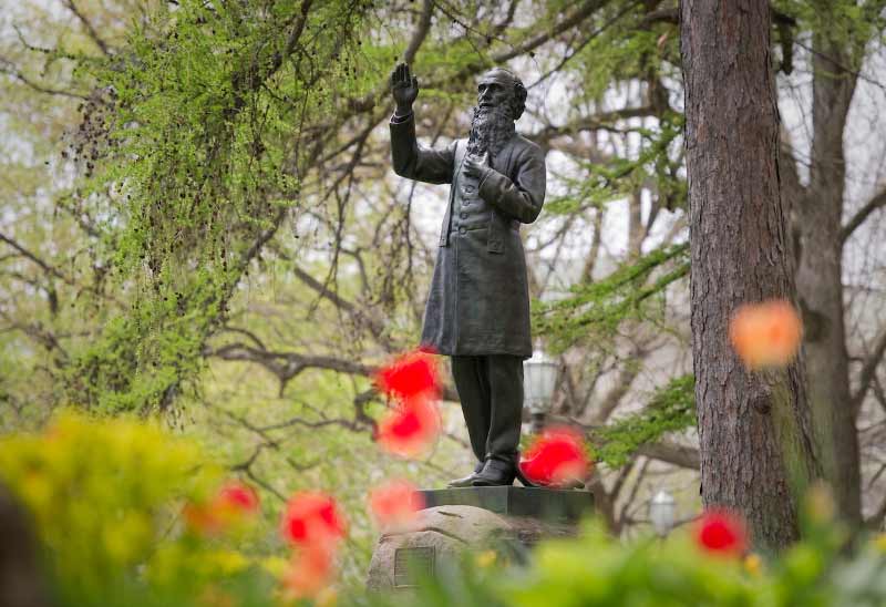 Statue of Rev. William Corby, C.S.C. in front of Corby Hall.