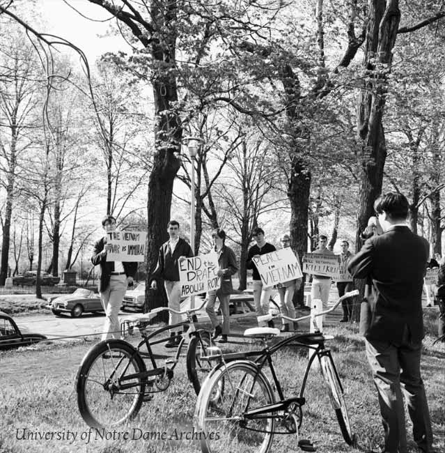 Students with signs protesting the Vietnam War, c1966.