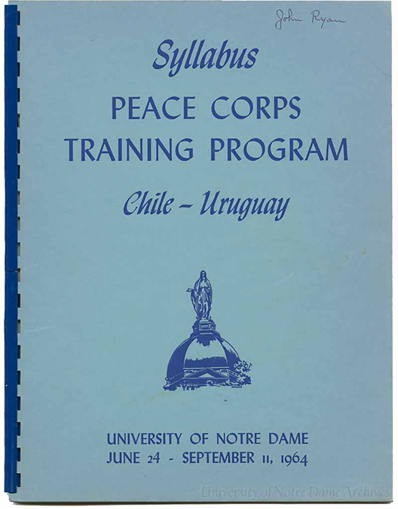 A blue binder syllabus that says &ldquo;Syllabus, Peace Corps Training Program, Chile - Uruguay, University of Notre Dame June 24 - September 11, 1964.&rdquo;