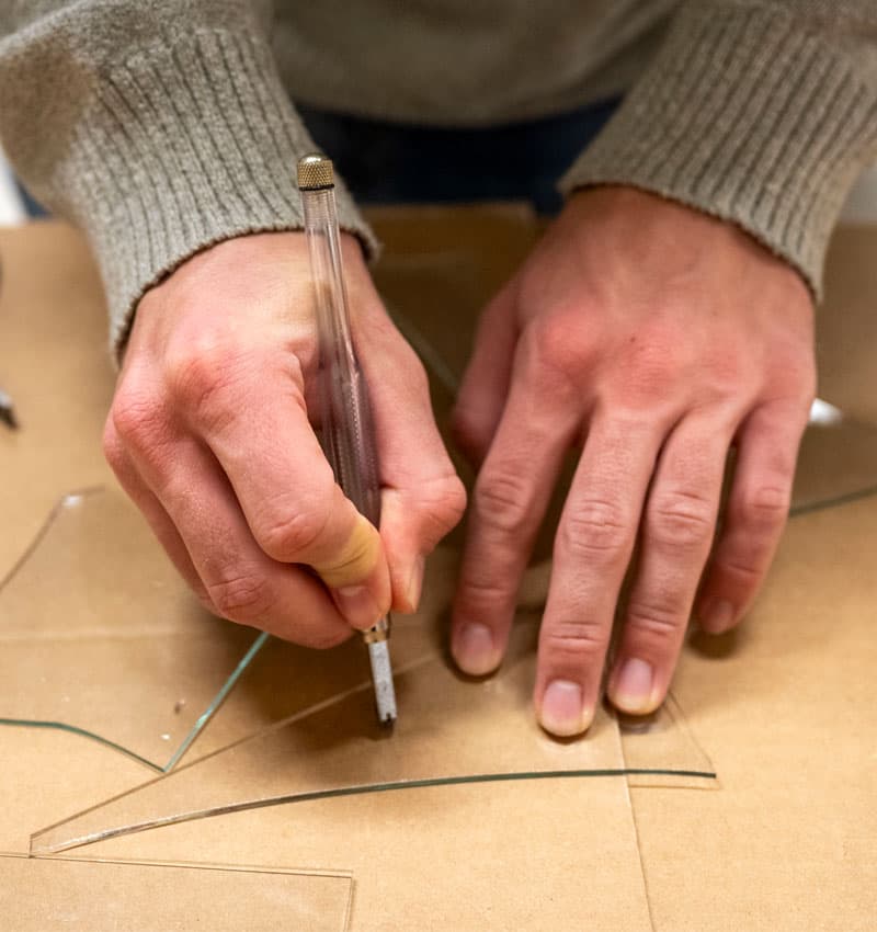 Students learn to cut glass in the Preservation Workshop during Stephen Hartley&rsquo;s Painting with Light class.