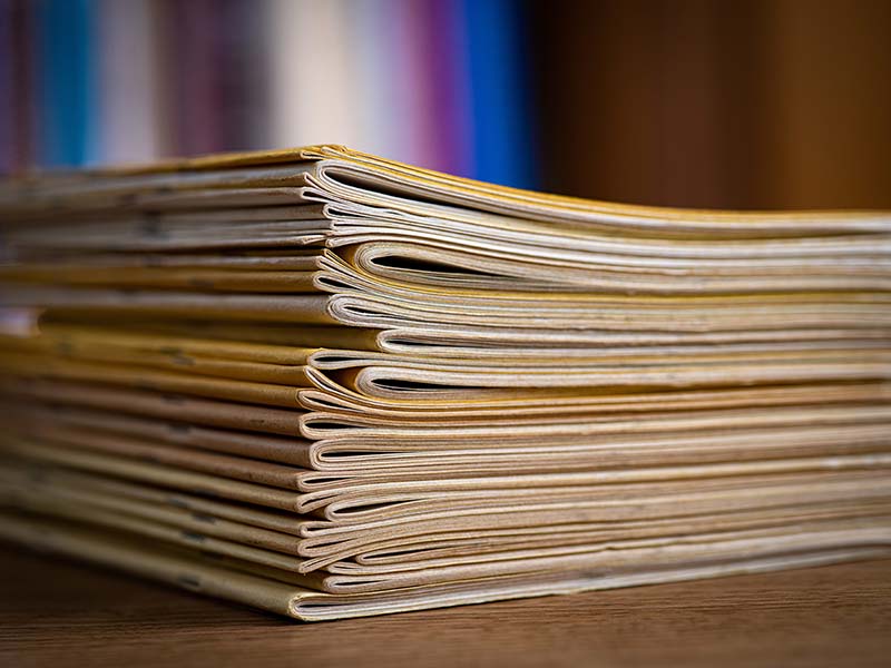 A side view of a stack of the journals.