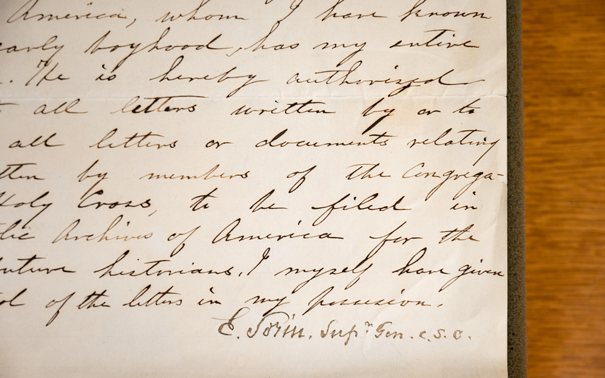 A close up of the calligraphic writing on a yellowed letter, focusing on Fr. Sorin&rsquo;s signature