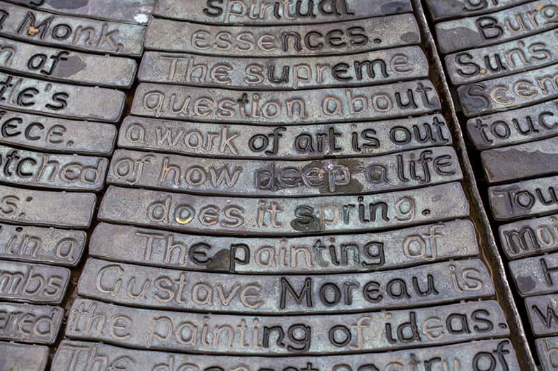 Inscriptiong on stone that reads The supreme question about a work of art is out of how deep a life does it spring. The painting of Custave Moreau is the painting of ideas.