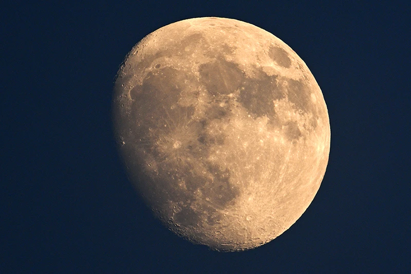 The full moon in a dark sky.